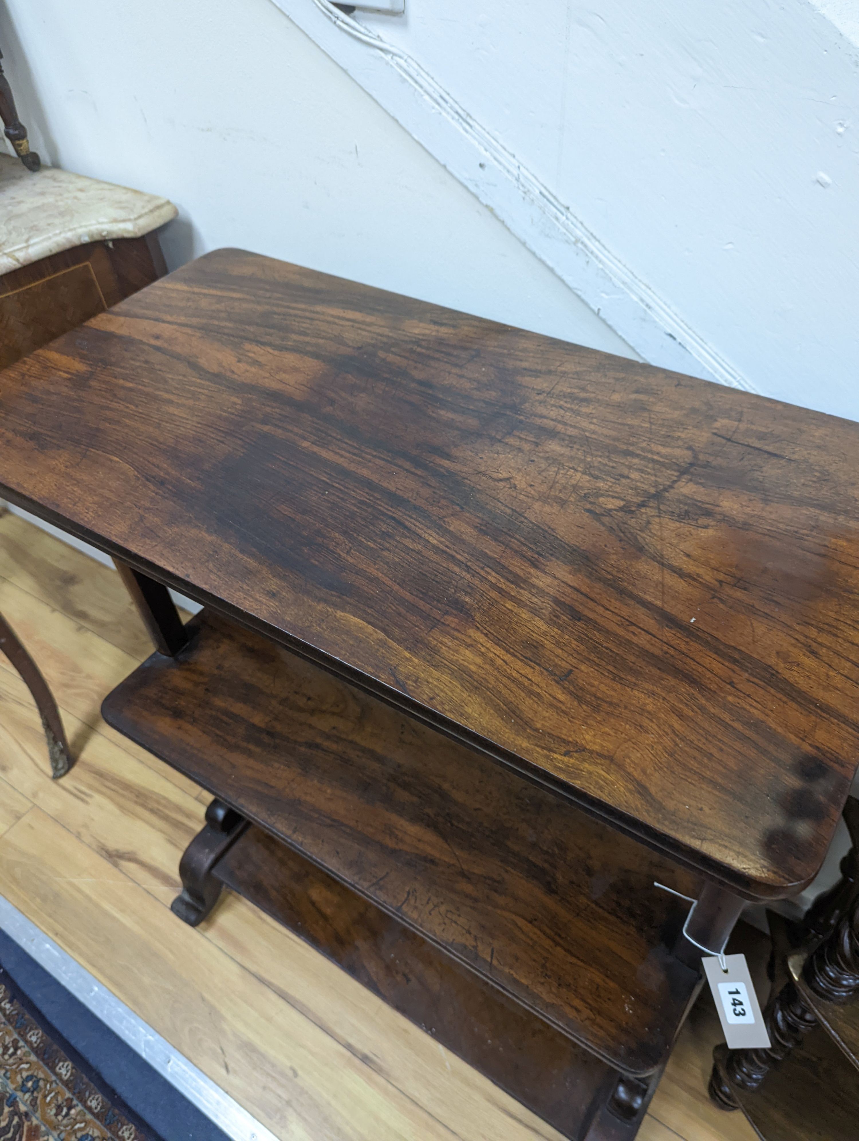 A Victorian rosewood three tier table. W-73cm, D-38cm, H-92cm.